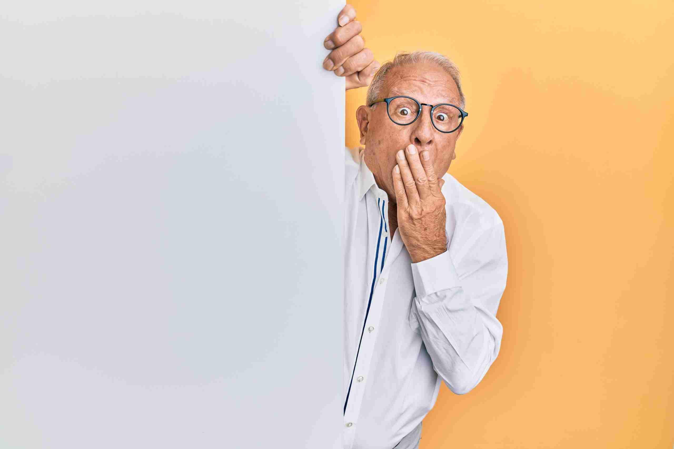 man in white dress shirt wearing black framed eyeglasses